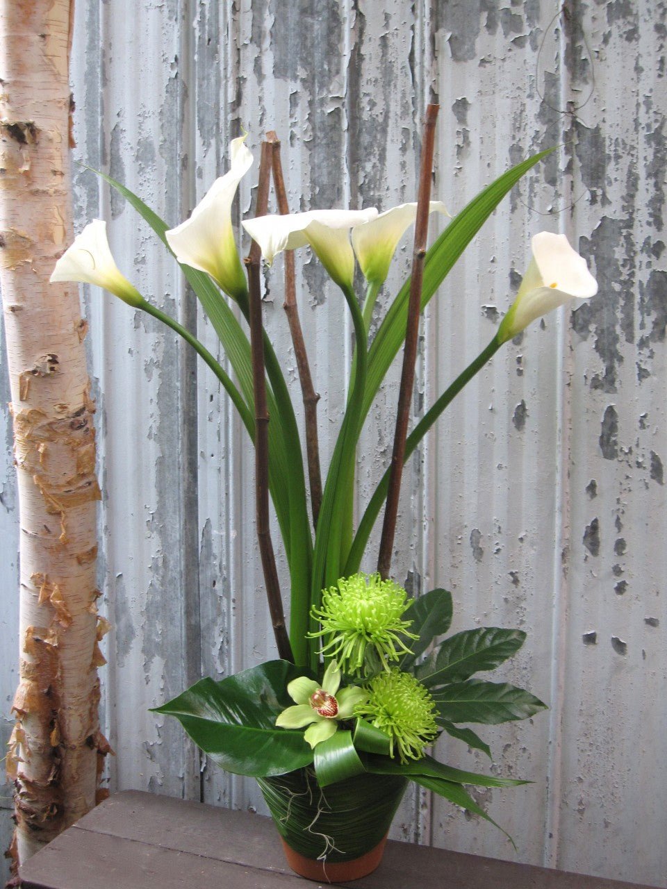 Callas et cymbidium - Fleuriste Abaca