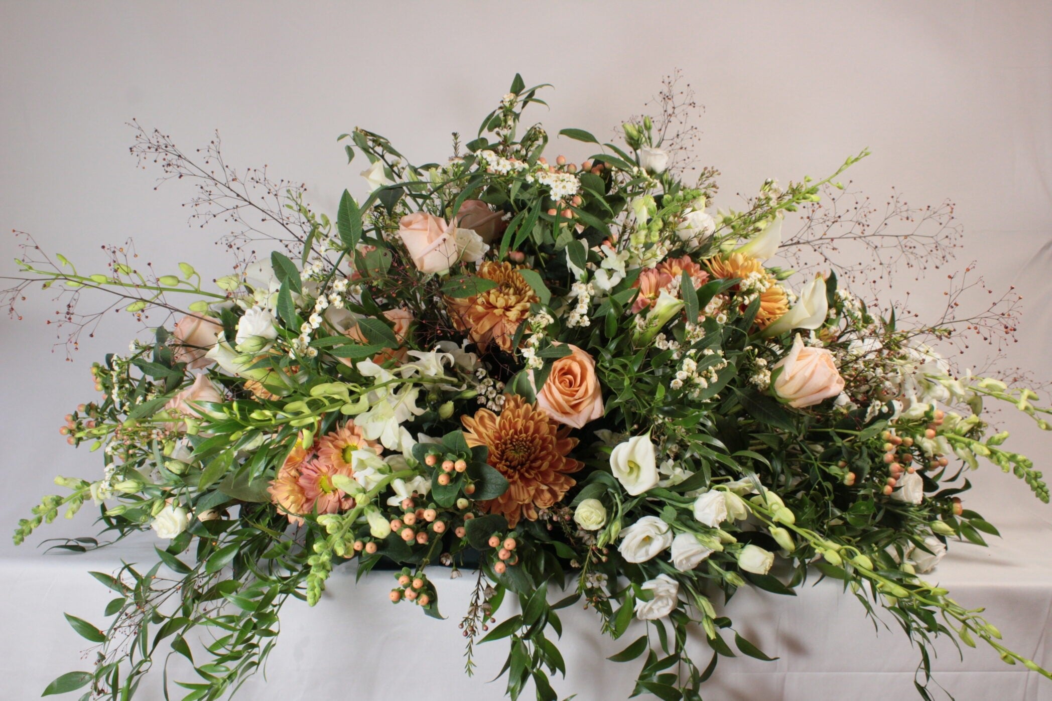 Coussin de fleurs pour cercueil Couleurs douces - Fleuriste Abaca